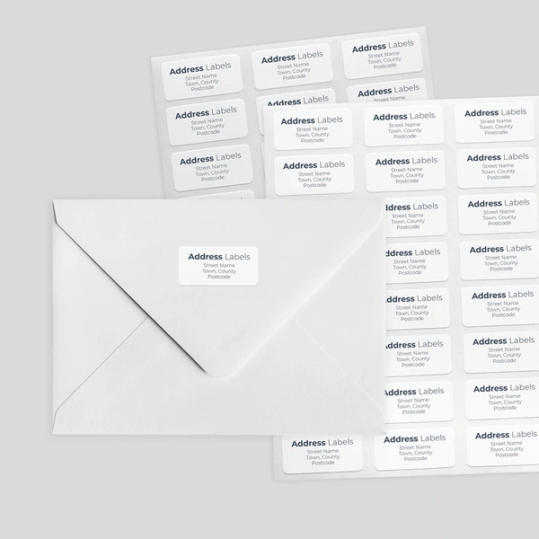 An example of a sheet of address labels and them being used on an envelope
